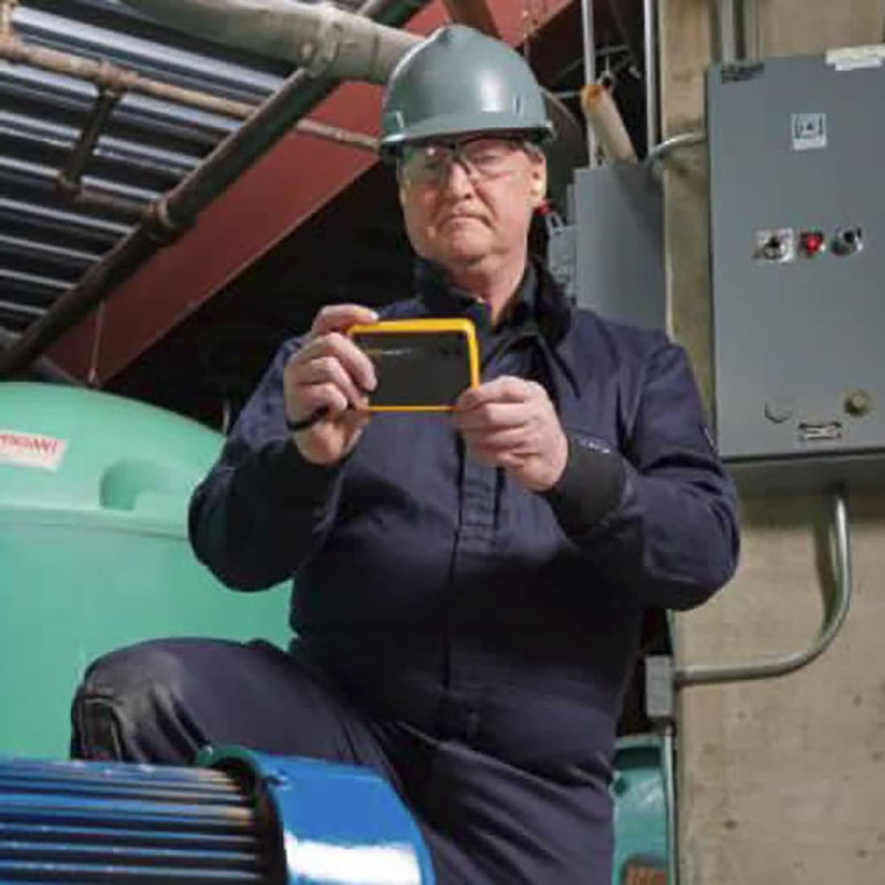Fluke PTi120 pocket thermal camera held in hand during an inspection